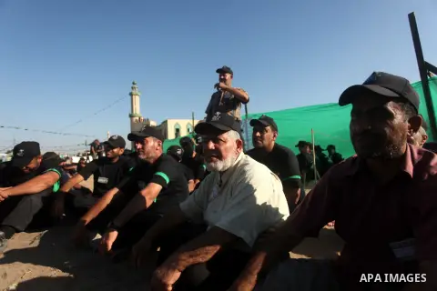 Palestinians take part in a military-style camp organized by the Hamas movement in Gaza City on July 28, 2015. Hamas's armed wing organized "Liberation Youths Camps" for young Palestinians aged between 15 and 21 to prepa...