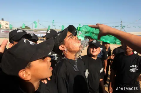 Palestinian youths demonstrate their skills during a military-style camp organized by the Hamas movement in Gaza City on July 28, 2015. Hamas's armed wing organized "Liberation Youths Camps" for young Palestinians aged b...