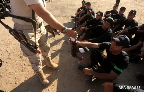 Palestinian youths take part in a military-style camp organized by the Hamas movement in Gaza City on July 28, 2015. Hamas's armed wing organized "Liberation Youths Camps" for young Palestinians aged between 15 and 21 to...