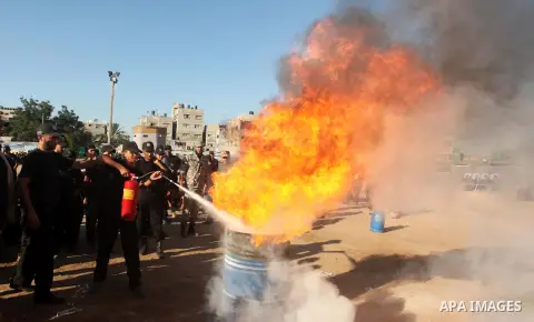 Palestinian youths demonstrate their skills during a military-style camp organized by the Hamas movement in Gaza City on July 28, 2015. Hamas's armed wing organized "Liberation Youths Camps" for young Palestinians aged b...