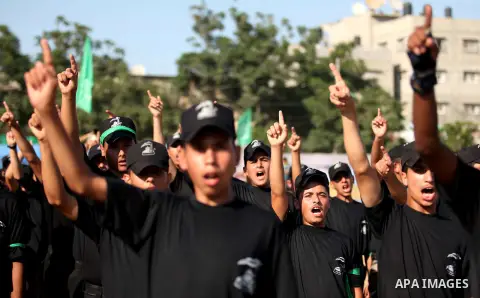 Palestinian youths demonstrate their skills during a military-style camp organized by the Hamas movement in Gaza City on July 28, 2015. Hamas's armed wing organized "Liberation Youths Camps" for young Palestinians aged b...