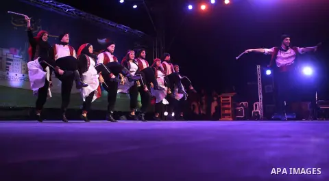 Palestinian from the Jouzour band for dabka perform during the Birzeit Nights Festival at Birzeit University in the West Bank city of Ramallah on July 28, 2015. Photo by Shadi Hatem