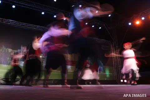 Palestinian from the Jouzour band for dabka perform during the Birzeit Nights Festival at Birzeit University in the West Bank city of Ramallah on July 28, 2015. Photo by Shadi Hatem