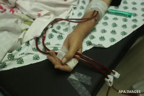 A Palestinian patient gets his kidneys washed at the dialysis department al-Aqsa Martyrs Hospital in Deir al-Balah in the northern Gaza Strip July 29, 2015. Photo by Ashraf Amra