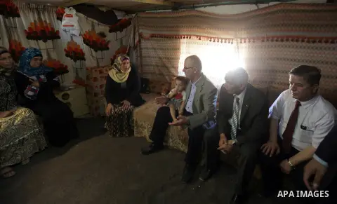 Palestinian prime minister Rami Hamadallah visits the village of Susia outside the West Bank village of Yatta, on June 29, 2015. Photo by Prime Minister Office