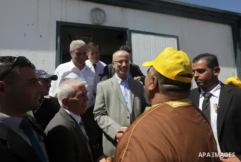 Palestinian prime minister Rami Hamadallah visits the village of Susia outside the West Bank village of Yatta, on June 29, 2015. Photo by Prime Minister Office
