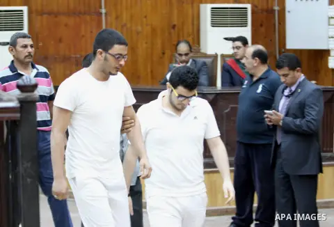 Members of Egyptian 'Ultras of Raba'wi' attend their trial in a court in Cairo on July 29, 2015. Photo by Amr Sayed