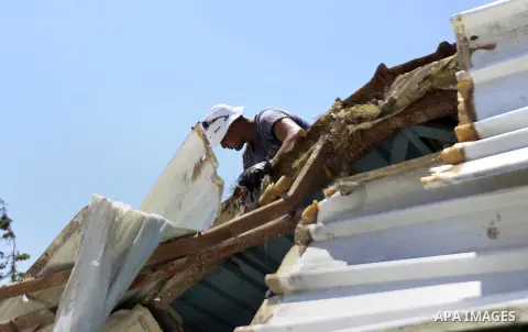 Palestinians search for their belongings after their businesses, consisting of a wedding hall and shop, were razed by the Israeli military in the Arab east Jerusalem neighbourhood of Beit Hanina on July 29, 2015. Accordi...