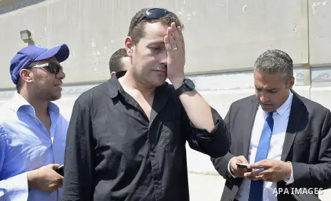 Egyptian Al-Jazeera English journalist Baher Mohammed, and Al-Jazeera English journalist Mohammed Fahmy, speak outside Tora prison, in Cairo, Egypt, Thursday, July 30, 2015. Egyptian judicial officials say a Cairo court...
