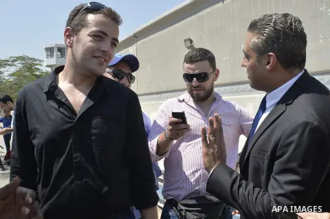 Egyptian Al-Jazeera English journalist Baher Mohammed, and Al-Jazeera English journalist Mohammed Fahmy, speak outside Tora prison, in Cairo, Egypt, Thursday, July 30, 2015. Egyptian judicial officials say a Cairo court...