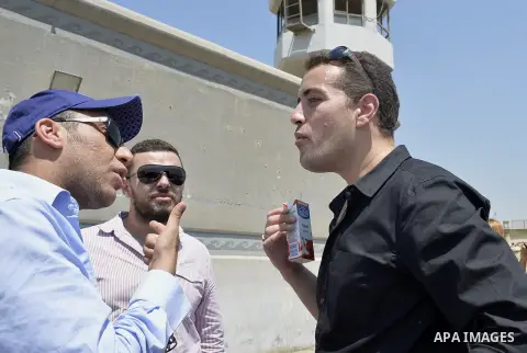 Egyptian Al-Jazeera English journalist Baher Mohammed stands outside Tora prison, in Cairo, Egypt, Thursday, July 30, 2015. Egyptian judicial officials say a Cairo court has postponed the verdict in the retrial of three...