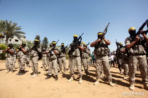 Palestinian militants of al-Aqsa brigades, the armed wing of Fatah movement, celebrate the release of prisoner Mahmoud Abu Amra from an Israeli jail, in Deir al-Balah in the central Gaza Strip, July 30, 2015. Abu Amra se...