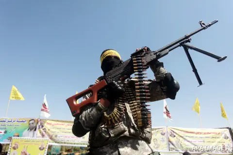Palestinian militants of al-Aqsa brigades, the armed wing of Fatah movement, celebrate the release of prisoner Mahmoud Abu Amra from an Israeli jail, in Deir al-Balah in the central Gaza Strip, July 30, 2015. Abu Amra se...