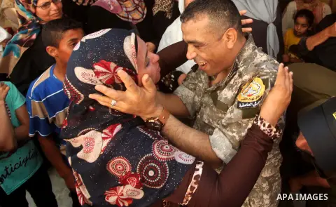 Freed Palestinian prisoner Mahmoud Abu Amra is welcomed by a relative upon his release from an Israeli jail, at his home in Deir al-Balah in the central Gaza Strip, July 30, 2015. Abu Amra served 12 years in the Israeli...