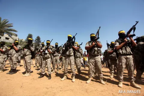 Palestinian militants of al-Aqsa brigades, the armed wing of Fatah movement, celebrate the release of prisoner Mahmoud Abu Amra from an Israeli jail, in Deir al-Balah in the central Gaza Strip, July 30, 2015. Abu Amra se...
