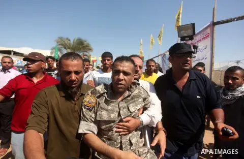 Freed Palestinian prisoner Mahmoud Abu Amra is welcomed by relatives upon his release from an Israeli jail, in Deir al-Balah in the central Gaza Strip, July 30, 2015. Abu Amra served 12 years in the Israeli jail after he...