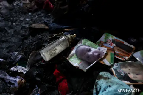 Pictures of a 18-months-old Palestinian boy and his family is seen burned at a house that was badly damaged from a suspected attack by Jewish extremists on two houses at Kafr Duma village near the West Bank city of Nablu...