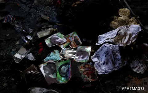 Pictures of a 18-months-old Palestinian boy and his family is seen burned at a house that was badly damaged from a suspected attack by Jewish extremists on two houses at Kafr Duma village near the West Bank city of Nablu...