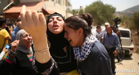 Palestinian women shout slogans during the funeral of Palestinian youth Laith al-Khaldi near the West Bank city of Ramallah August 1, 2015. Al-Khaldi died on Saturday at a West Bank hospital following a clash with Israel...