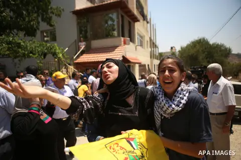 Palestinian women shout slogans during the funeral of Palestinian youth Laith al-Khaldi near the West Bank city of Ramallah August 1, 2015. Al-Khaldi died on Saturday at a West Bank hospital following a clash with Israel...