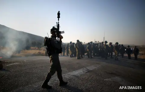 Israeli soldiers clash with Palestinians at the entrance of Duma village near the West Bank city of Nablus, Saturday, Aug. 1, 2015. Tensions remain high after suspected Jewish assailants set fire to a West Bank home and...