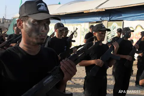 Palestinian youths demonstrate their skills during a military-style exercise at the Liberation Youths summer camp, organised by the Hamas movement, in Rafah in the southern Gaza Strip August 1, 2015. Hamas stages dozens...