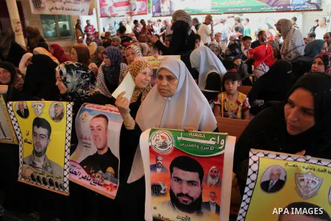 Palestinians take part in a protest demanding release the prisoners in Israeli jails, in front of Red cross office, in Gaza city, on on August 03, 2015. Photo by Ashraf Amra