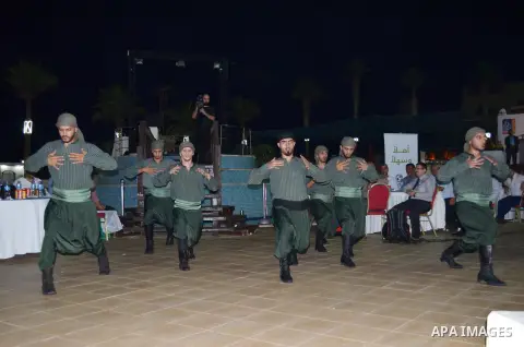 Palestinians perform during a reception ceremony of the Hebron's Al-Ahly team in Gaza city on August 4, 2015. The soccer teams of the Gaza Strip's Shejaia and al-Ahly from Hebron in the Israeli-occupied West Bank will pl...