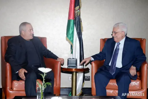 Palestinian President Mahmoud Abbas meets with Jordan's Foreign Minister Nasser Jouda, in Cairo on August 5, 2015. Photo by Thaer Ganaim