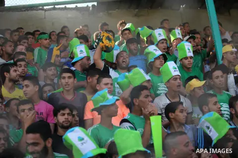 Fans attend the first leg match of the Palestine Cup final between Palestinian Gaza's Shejaya team and Hebron's Al-Ahly team at Yarmuk stadium in Gaza City, on August 6, 2015, as the two teams play each other for the fir...
