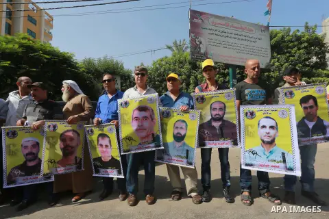 Palestinians take part in a protest demanding release the prisoners in Israeli jails, in front of Red cross office, in Gaza city, on on August 10, 2015. Photo by Mohammed Asad