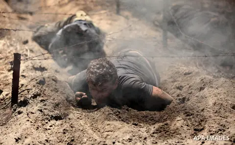 Palestinian youths take part in a military-style exercise during a summer camp organized by Islamic Jihad movement, in Gaza city, on August 13, 2015. Photo by Ashraf Amra