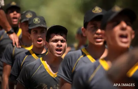 Palestinian youths take part in a military-style exercise during a summer camp organized by Islamic Jihad movement, in Gaza city, on August 13, 2015. Photo by Ashraf Amra