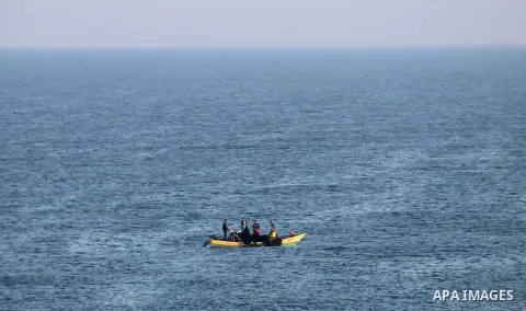 Palestinians ride a boat in the Mediterranean Sea on the coast of Gaza City on August 14, 2015. Photo by Khaled Dawood