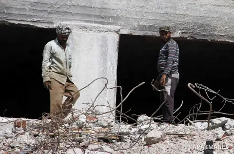 Egyptian laborers work during the demolition of the headquarters of the once-dominant party of ex-president Hosni Mubarak that was torched during the 2011 uprising that toppled him, on August 16, 2015 in the capital, Cai...