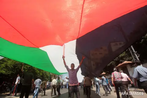 Palestinians hold placards during a protest to show solidarity with prisoner Mohammad Allan allegedly being held in an Israeli jail, in Gaza city on August 19, 2015. The Israeli military prosecutor intends to request cou...