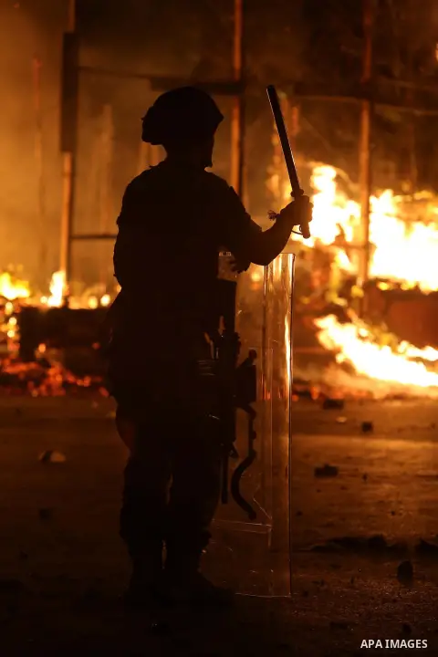 Army soldiers patrol the streets in Beirut as protestors demand the Lebanese government resign over its failure to remove uncollected rubbish from the streets on August 23, 2015. Demonstrators clashed with police in Beir...