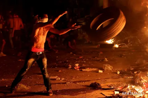 Lebanese protesters clash with security forces following a demonstration against the ongoing trash crisis on August 25, 2015, in front of the seat of the government in central Beirut. Lebanon's cabinet ended an acrimonio...