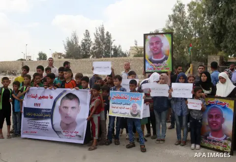 Families of Palestinians who were abducted of by gunmen is Egypt's Sinai's northern region, take part in a demonstration calling for the release at the Rafah border crossing with Egypt in the southern Gaza Strip, on Augu...