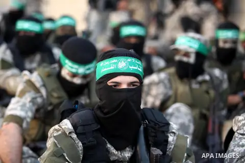 Palestinian militants of the Ezzedine al-Qassam Brigades, Hamas' armed wing, take part in a military parade in Gaza city on August 26, 2015. Photo by Ashraf Amra