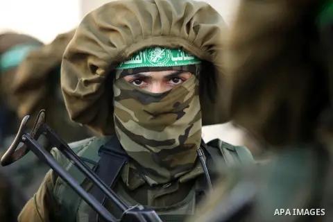 Palestinian militants of the Ezzedine al-Qassam Brigades, Hamas' armed wing, take part in a military parade in Gaza city on August 26, 2015. Photo by Ashraf Amra