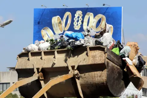 A Lebanese worker uses a bulldozer to remove waste from a street in Beirut's eastern suburb of Dora to a temporary location outside of the Lebanese capital on August 27, 2015. A trash crisis began in Lebanon after the go...