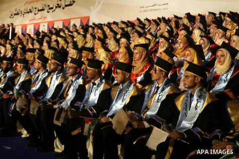 Palestinian students take part in their graduation ceremony at Al-Aqsa University in Khan Younis in the southern of Gaza strip on August 29, 2015. Photo by Abed Rahim Khatib
