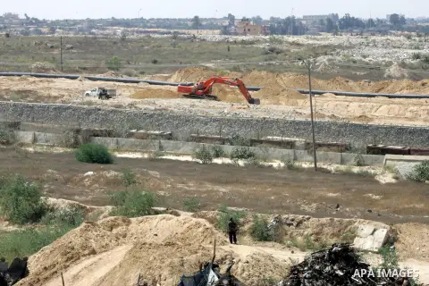 Bulldozers and diggers work on the Egyptian side of the border with the southern Gaza Strip town of Rafah, Sep. 1, 2015. Egypt has renewed its military campaign by digging up tunnels along its border with the Gaza Strip...