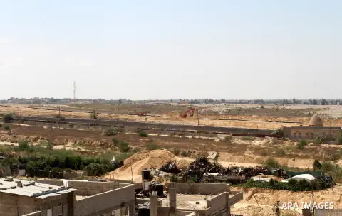 Bulldozers and diggers work on the Egyptian side of the border with the southern Gaza Strip town of Rafah, Sep. 1, 2015. Egypt has renewed its military campaign by digging up tunnels along its border with the Gaza Strip...