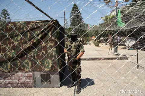 Palestinian militants of the Ezzedine al-Qassam Brigades, Hamas' armed wing, participate in the opening of the exhibition of the al-Qassam mock prisons, in Gaza city, on Sep. 02, 2015. Photo by Ashraf Amra