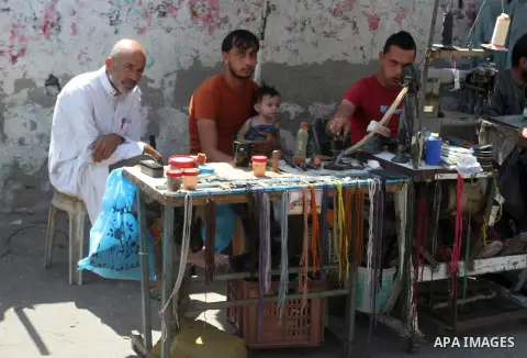 Palestinian shop at the saturday's popular market in Rafah in the southern Gaa strip, on September 5, 2015. Photo by Abed Rahim Khatib