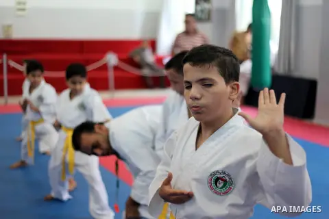 Blind and visually impaired Palestinian boys take part in a Karate class at al-Masthal club in Gaza city Sep. 06, 2015. The training is held twice a week by the club to lift the morale of the children, trainers said. Pho...
