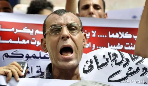 Egyptian teachers and students shout slogans during a protest against the Minister of Education Moheb El-Rafie, and demanding for his dismissal, outside the journalists syndicate, in Cairo on September 10, 2015. Photo by...