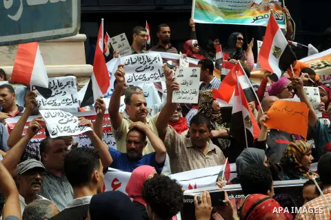 Egyptian teachers and students shout slogans during a protest against the Minister of Education Moheb El-Rafie, and demanding for his dismissal, outside the journalists syndicate, in Cairo on September 10, 2015. Photo by...